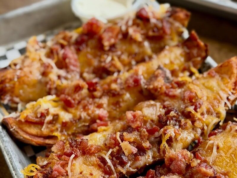 Loaded potato bites with melted cheddar and bacon